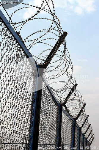 Image of fence with barbed wire