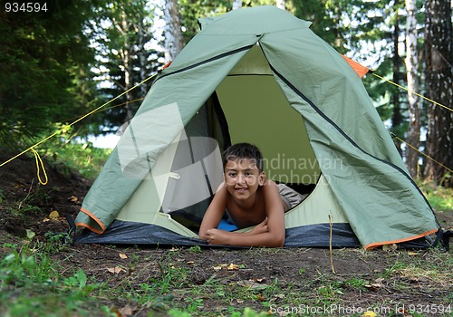 Image of smiling boy in tent