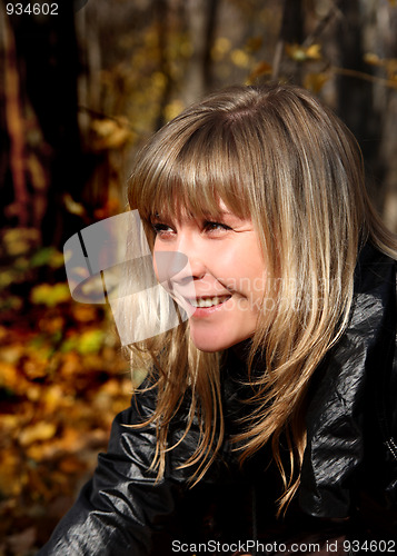 Image of portrait of beautiful girl in autumn park
