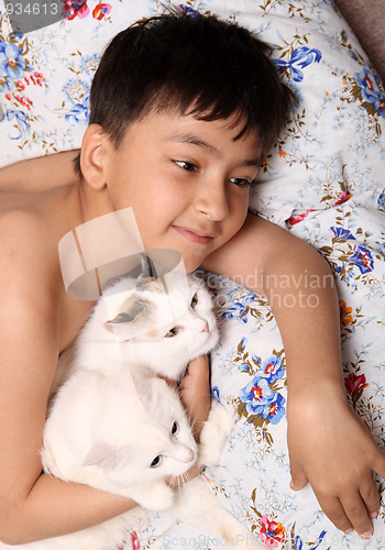 Image of happy boy with cats