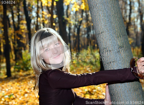 Image of smiling girl in autumn park