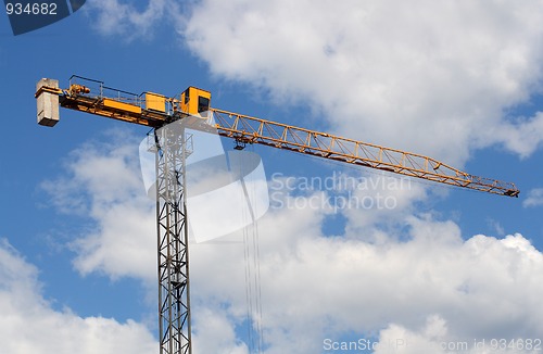 Image of lifting crane uder blue sky