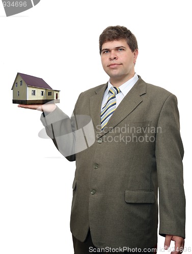 Image of businessman with house in hand