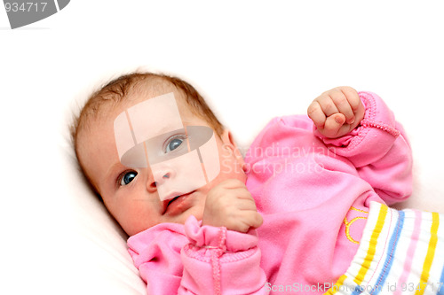 Image of watchful baby on pillow