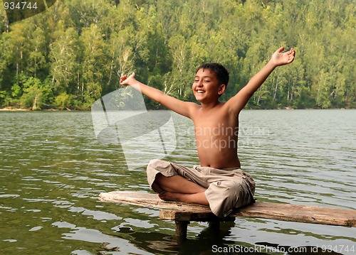 Image of happy asian boy with hands up