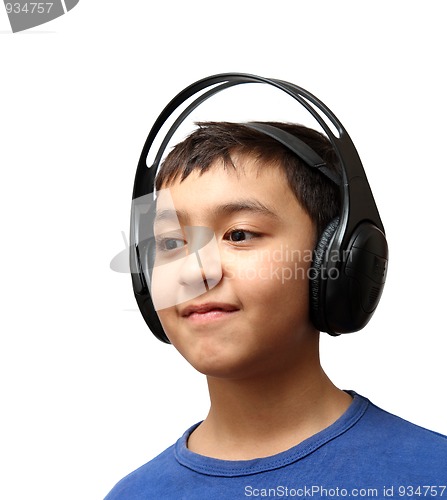 Image of boy listening music in wireless headphones