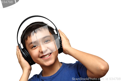 Image of boy listening music in headphones