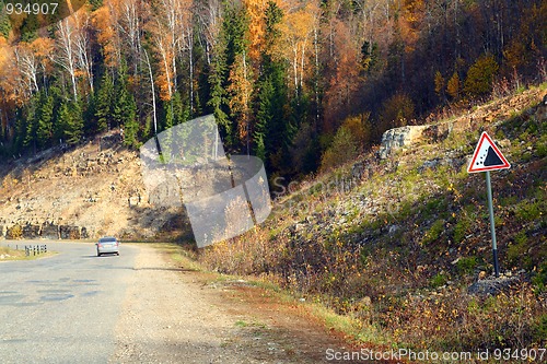 Image of road with sign in mountains