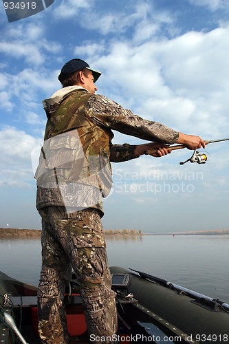 Image of man fishing with spinning