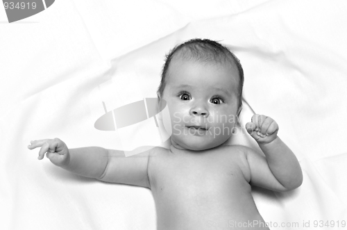 Image of baby on white sheet