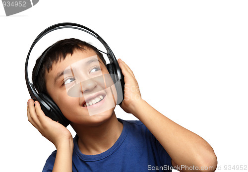 Image of boy listening music in headphones