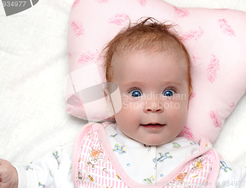 Image of smiling newborn baby girl