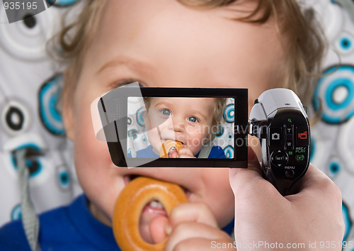 Image of baby boy recording to camcorder