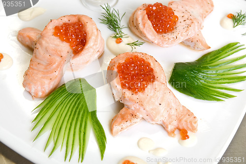Image of roasted salmon filet with red caviar