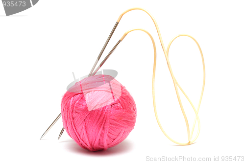 Image of Pink clew with knitting needles isolated on white