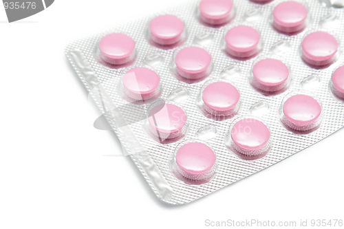 Image of Pink pills on white background