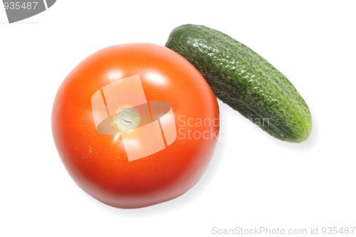Image of Red ripe tomato and a cucumber isolated on white