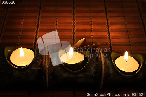 Image of Candles on bamboo rug