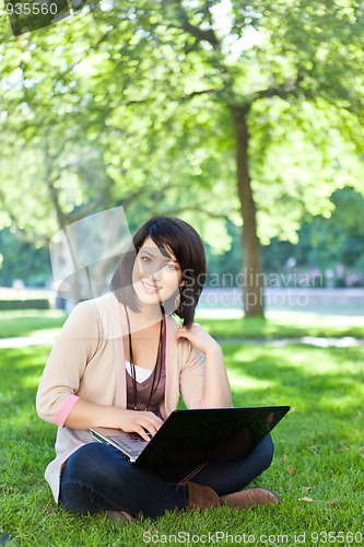 Image of Mixed race college student with laptop