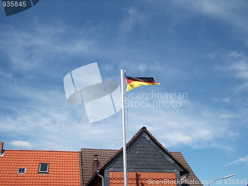 Image of Flag of Germany agains  the blu sky