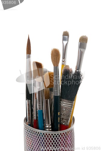 Image of Paintbrushes in a metal mesh holder