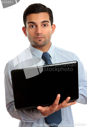Image of Business man with open laptop