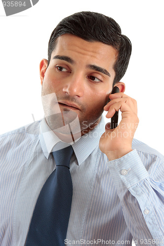 Image of Businessman on mobile phone thinking