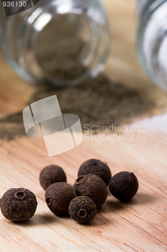 Image of pepper on wooden background 