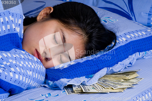 Image of woman with money under her pillow