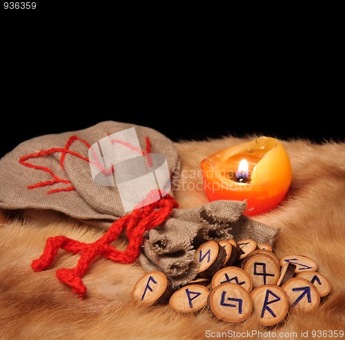 Image of Runes, pouch and candle with copy space