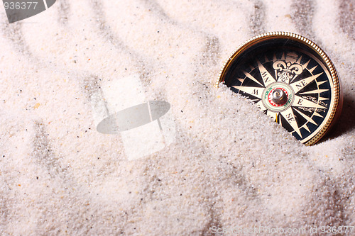 Image of Compass in sand