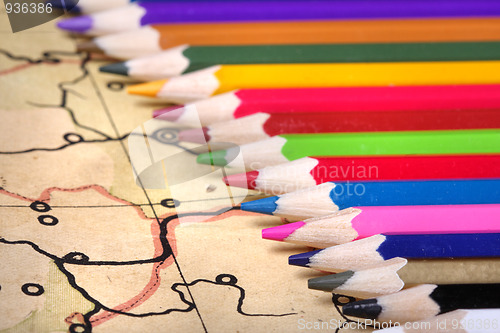 Image of Color pencils on old map