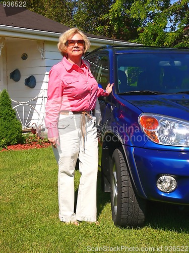 Image of Lady with blue car                            