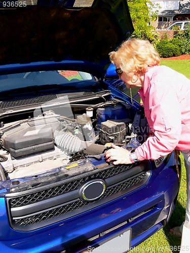 Image of Lady with blue car                                 