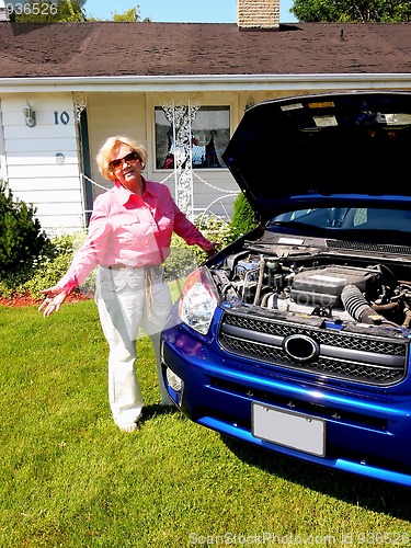 Image of Lady with blue car                             