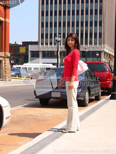 Image of Young lady in city  