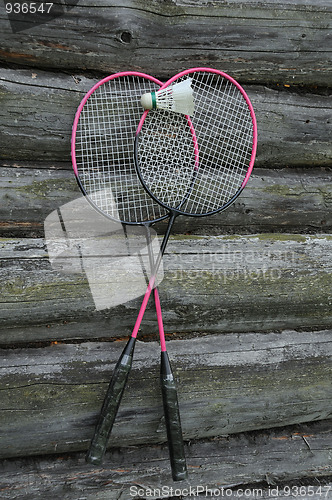 Image of Badminton Rackets and Birdie on the Wooden Wall