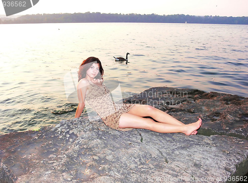 Image of Lady on the lake in sunset  