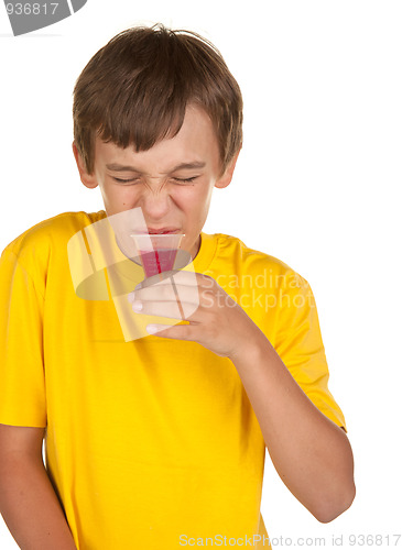 Image of boy drinking medicine