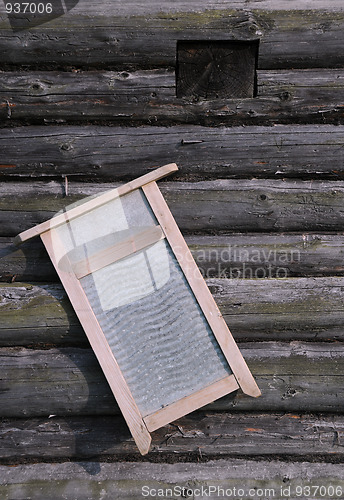 Image of Washboard on Old Log House Wall
