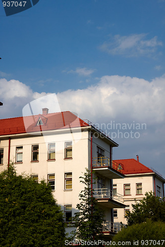 Image of building with a red tile roof