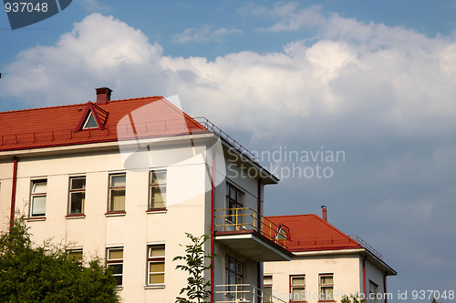 Image of building with a red tile roof