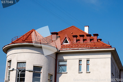 Image of building with a red tile roof