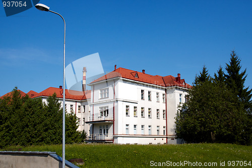 Image of building with a red tile roof