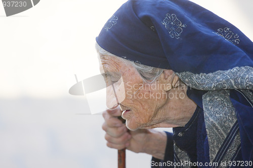 Image of Elderly woman with stick