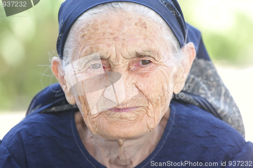Image of Thoughtful elderly woman
