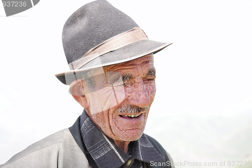 Image of Elderly man in hat