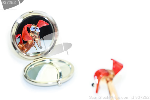 Image of Glass dachshund looking in the mirror