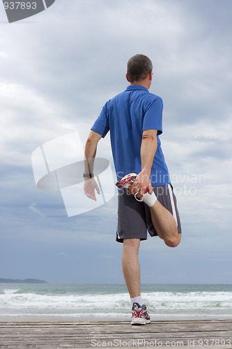 Image of Runner doing stretching exercise