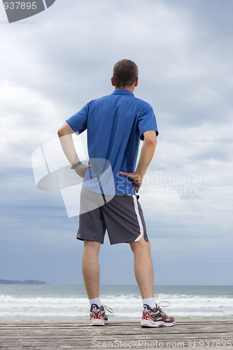 Image of Runner relaxing on a beach